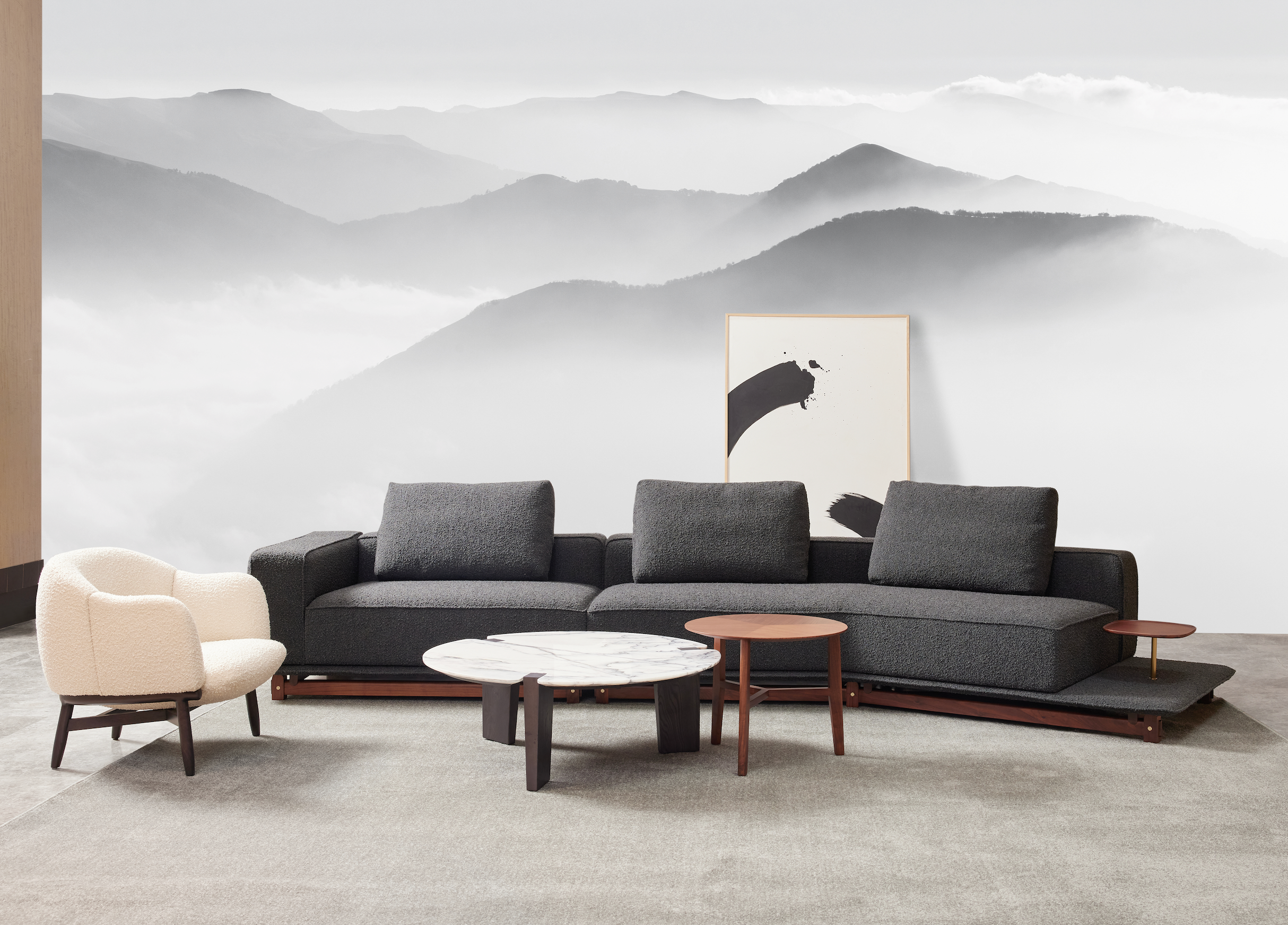 Ink Sofa with Side Table by Meraki Decoration placed in a modern lounge setting, offering both style and functionality with its integrated side table.