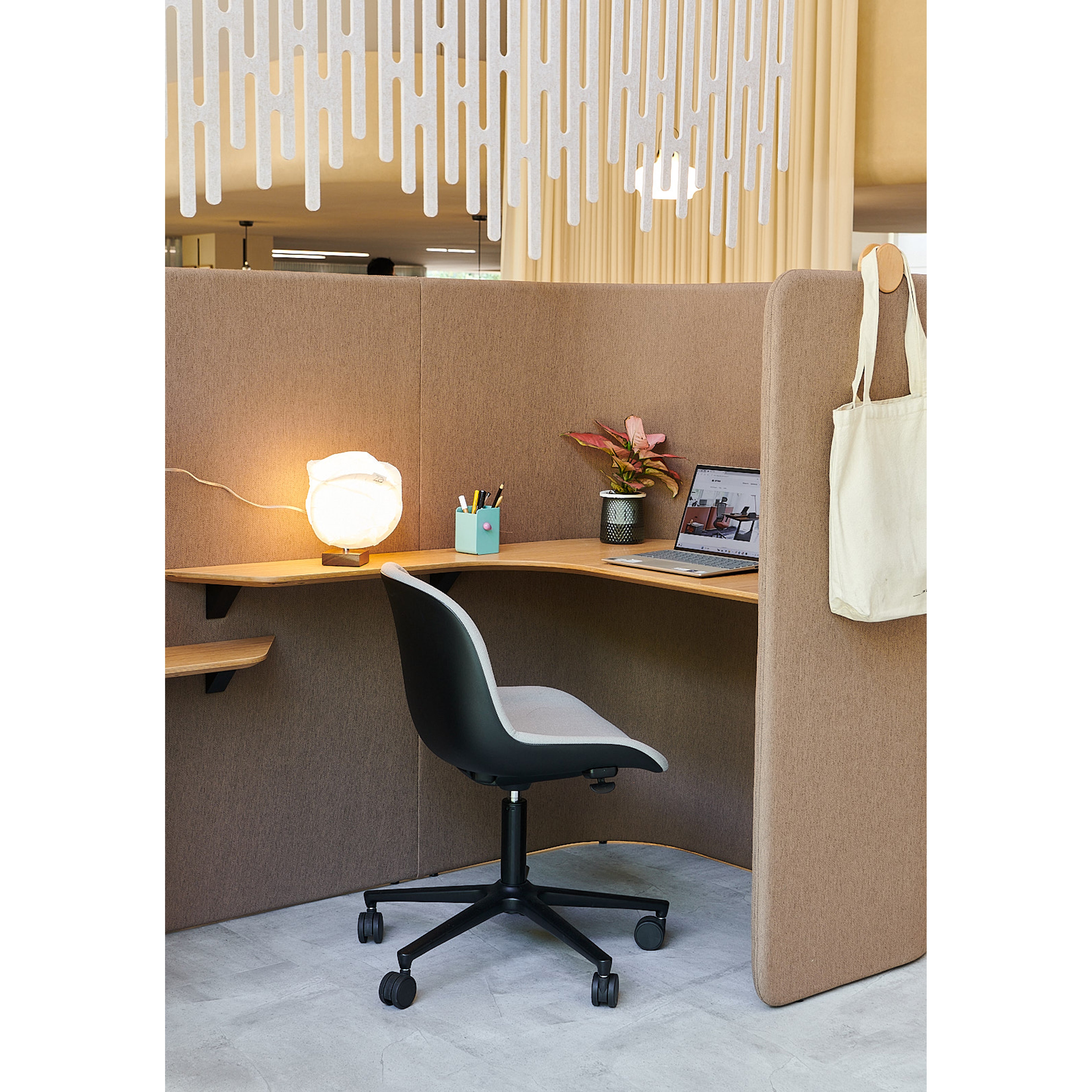 Interior view of U-Box Privacy Pod II, featuring ergonomic seating and sound insulation for enhanced privacy and productivity in busy workspaces. 